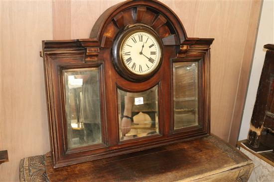 An overmantel mirror with clock insert, W.90cm